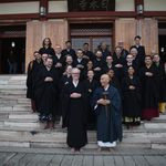 Students and staff with Ekai Korematsu Roshi and Arthur McKeown on the steps of a Buddhist temple