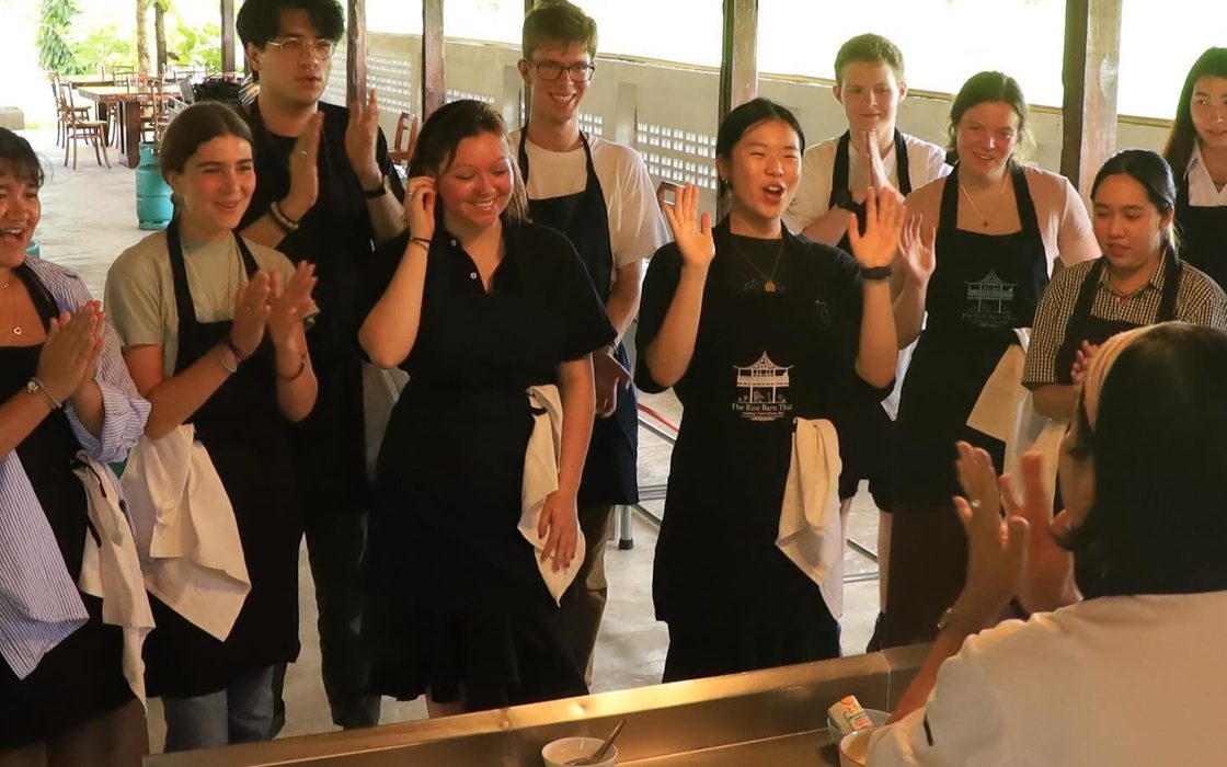 students prepare for Thai cooking instruction