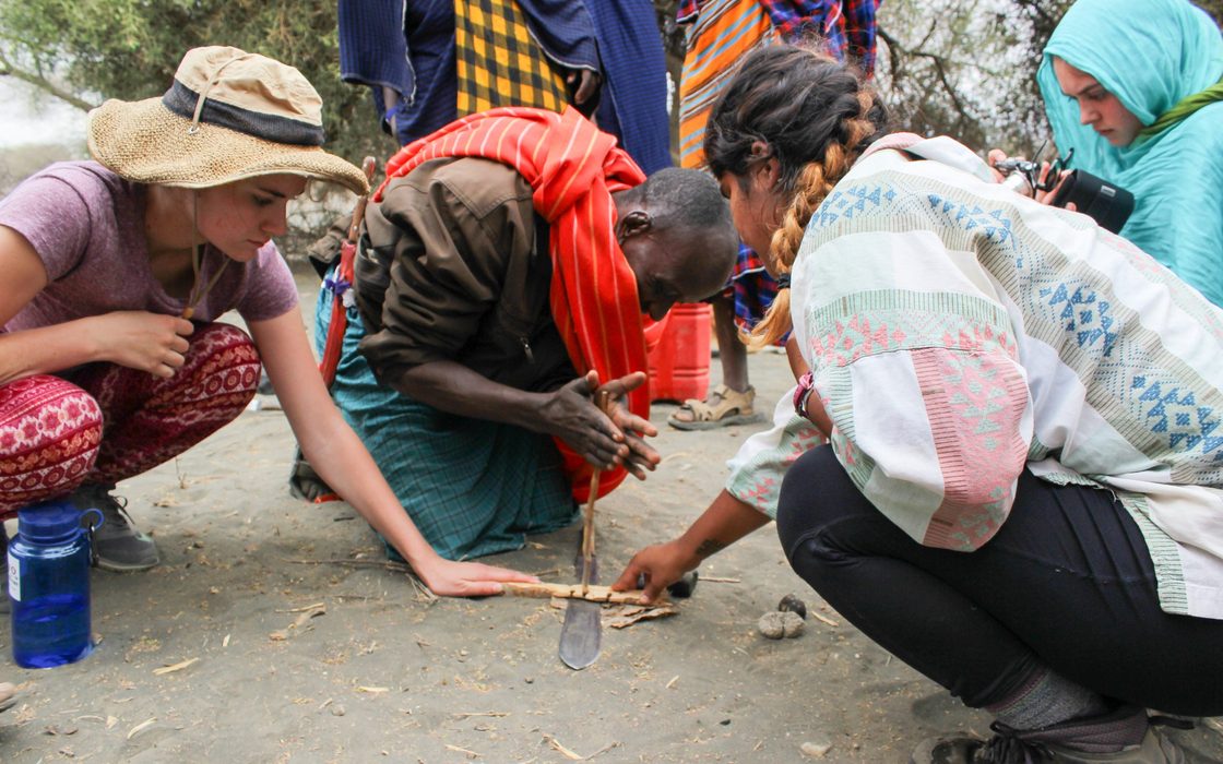 Students helping to start the fire