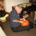 Jay carves a pumpkin.