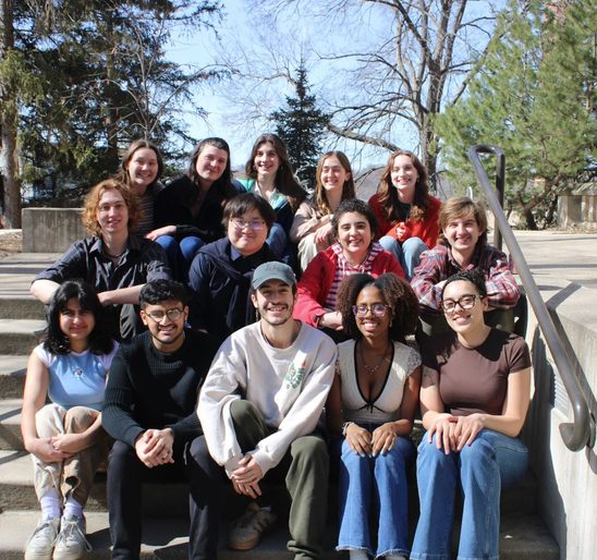 SOAN seniors posing for a group photo on the stairs outside of Leighton at the winter '25 End-Of-Term Party.