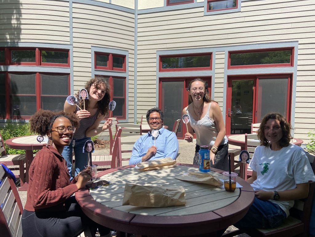 A group of SOAN students and faculty posing for a picture on the AGH patio at the spring '25 New Majors Gathering.