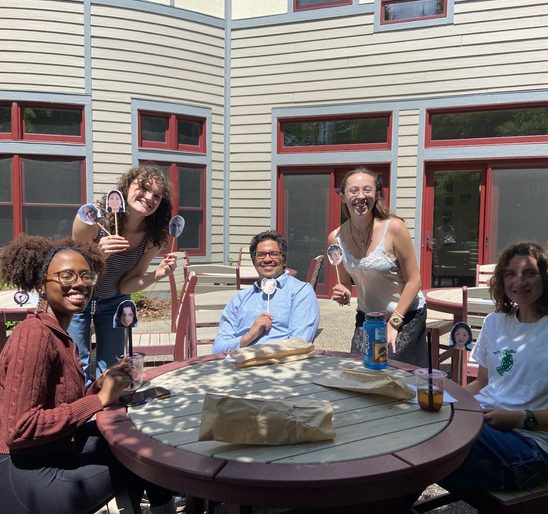 A group of SOAN students and faculty posing for a picture on the AGH patio at the spring '25 New Majors Gathering.