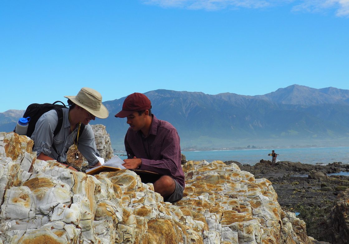 students working on outcrop in New Zealand