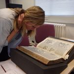 Maddy examines a 16th Century History Manuscript