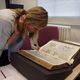 Maddy examines a 16th Century History Manuscript