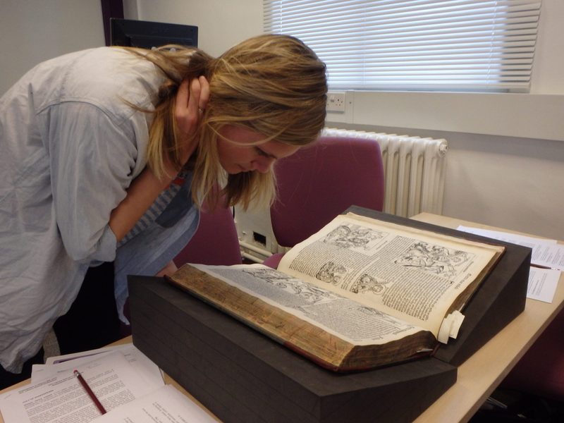Maddy examines a 16th Century History Manuscript
