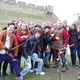 The group posing with the longbow demonstrator at Warwick Castle