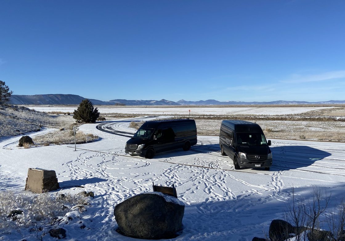 black vans parked in the snow