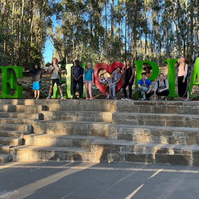 Students posing in a sculpture that spells out Ethiopia