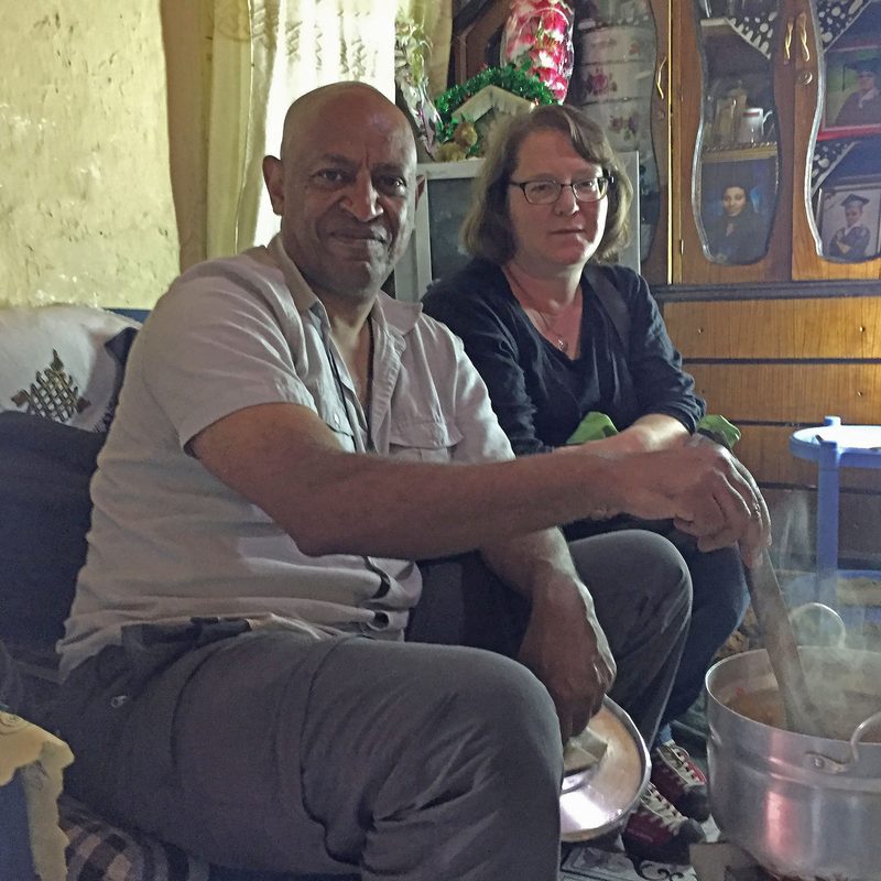 Faculty Directors Tsegaye Nega and Deborah Gross in a home in Ethiopia