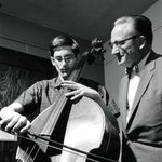 A student receives bass lessons from instructor Kenneth Davenport at the music hall in 1964.