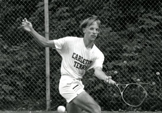 Carleton tennis player Tom James '89 returns the ball at a game during during 1987-1988.