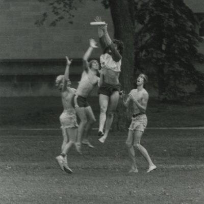 Carleton students playing frisbee in the 1970s.