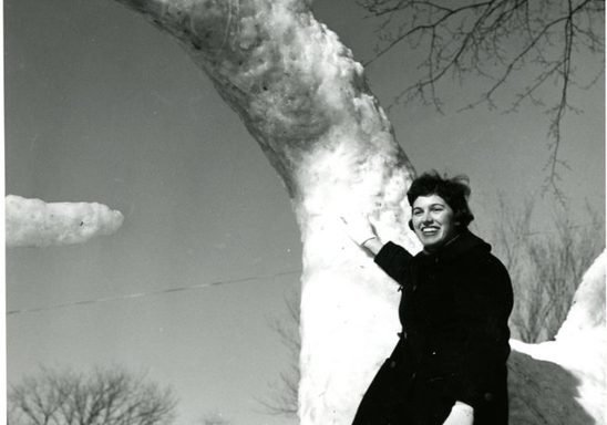 Knight and dragon snow sculpture, 1960. Student is Carole Pushing '61.