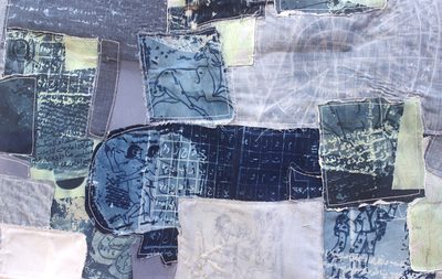 a patchwork of blue and white fabric