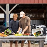 Students George and Aley at the student farm at Carleton College in Northfield, Minnesota, on Thursday, October 3, 2024. Photo by Jenn Ackerman and Tim Gruber @ackermangruber