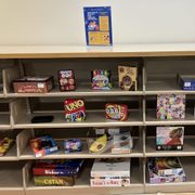 games and puzzles on a shelf in the new Pause & Play area of Gould Library