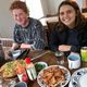 Carleton students enjoy an Icelandic Dinner, Raven Dawson '22 and Tali Emlen '22 Eating Dinner in Dalvík, Northern Iceland