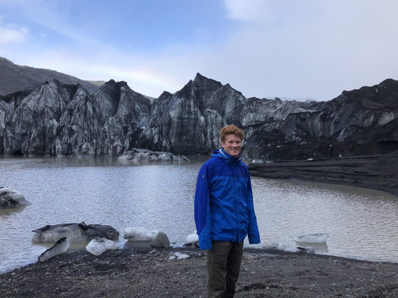 Student in Icelandic Mountains, Raven Dawson '22 at the Glacier Sólheimajökull