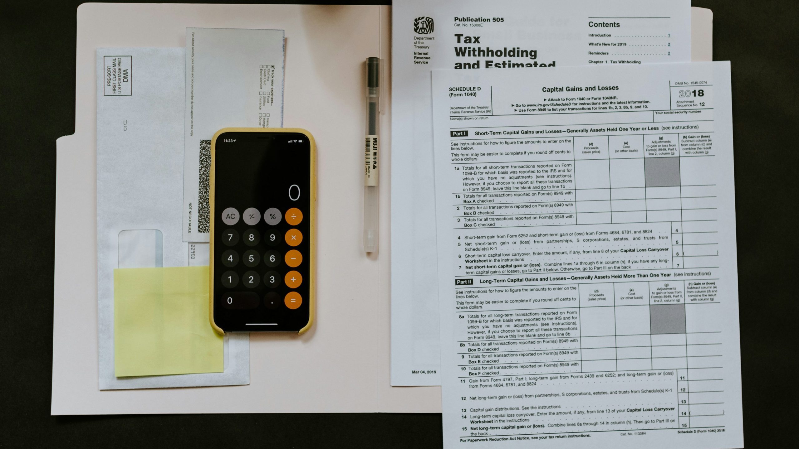 Overhead view of tax forms on a desk