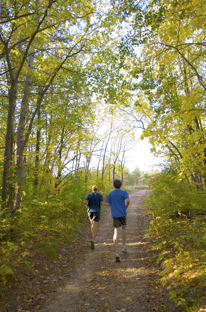 Two students enjoying a run in the Arboretum. Photo by Tom Roster.