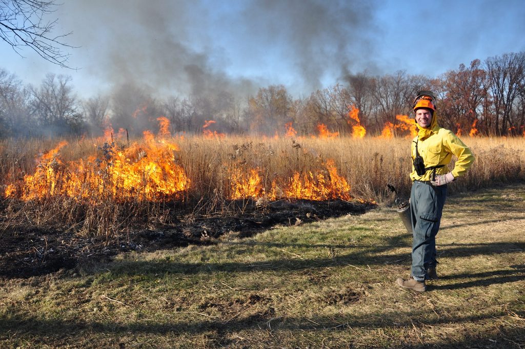 Jared Beck '14 working on a controlled burn of the Arboretum prairie.