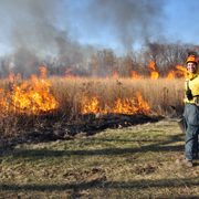 Jared Beck '14 working on a controlled burn of the Arboretum prairie.