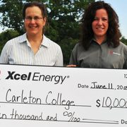 Carleton Director of Cowling Arboretum Nancy Braker (left) and Pamela Gorman, Xcel Energy Manager of Community Relations