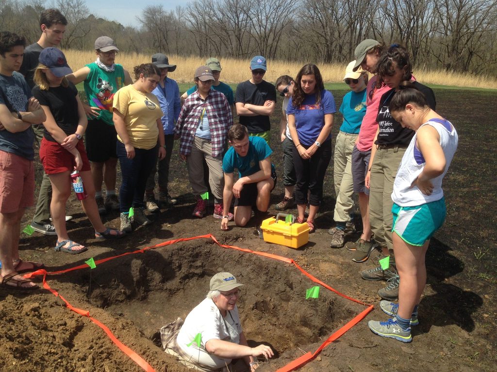 A soils class investigates the underground history of the Upper Arboretum with Mary Savina, Professor of Geology, Emerita.