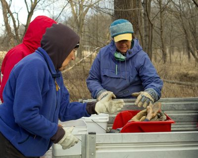 Volunteers help Nancy at a 3rd Saturday event