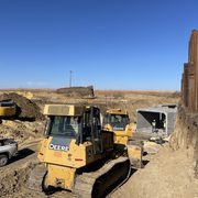 Construction machinery at a dig/work site on the edge of Arboretum Prairie.