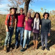 Five student naturalists pose together for a photo in the Arboretum.
