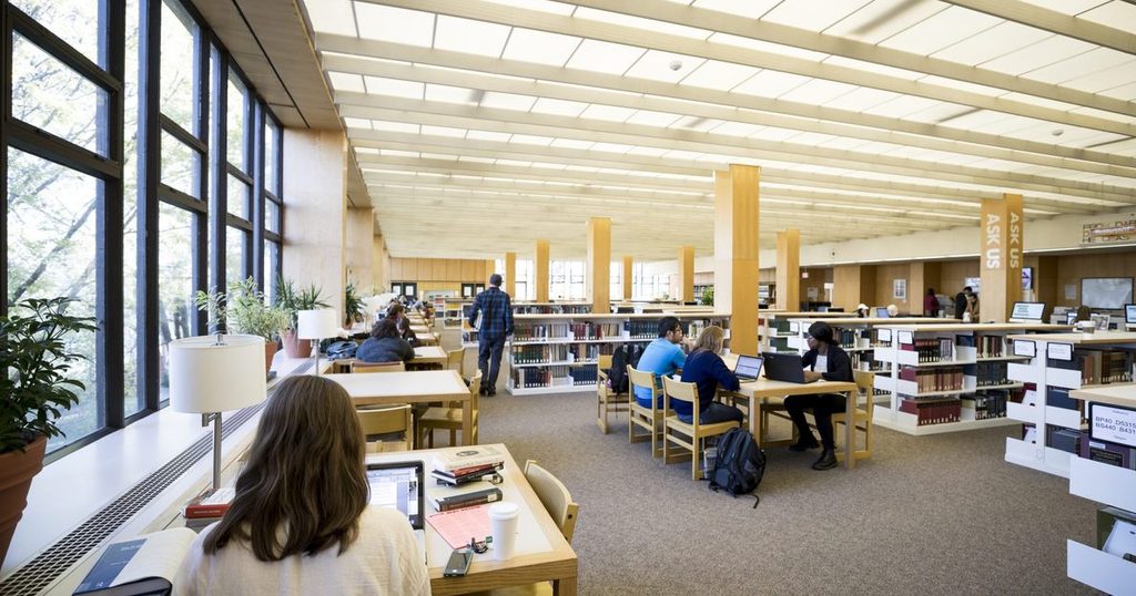 students scattered around the library studying