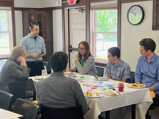 group of people gathered in a meeting