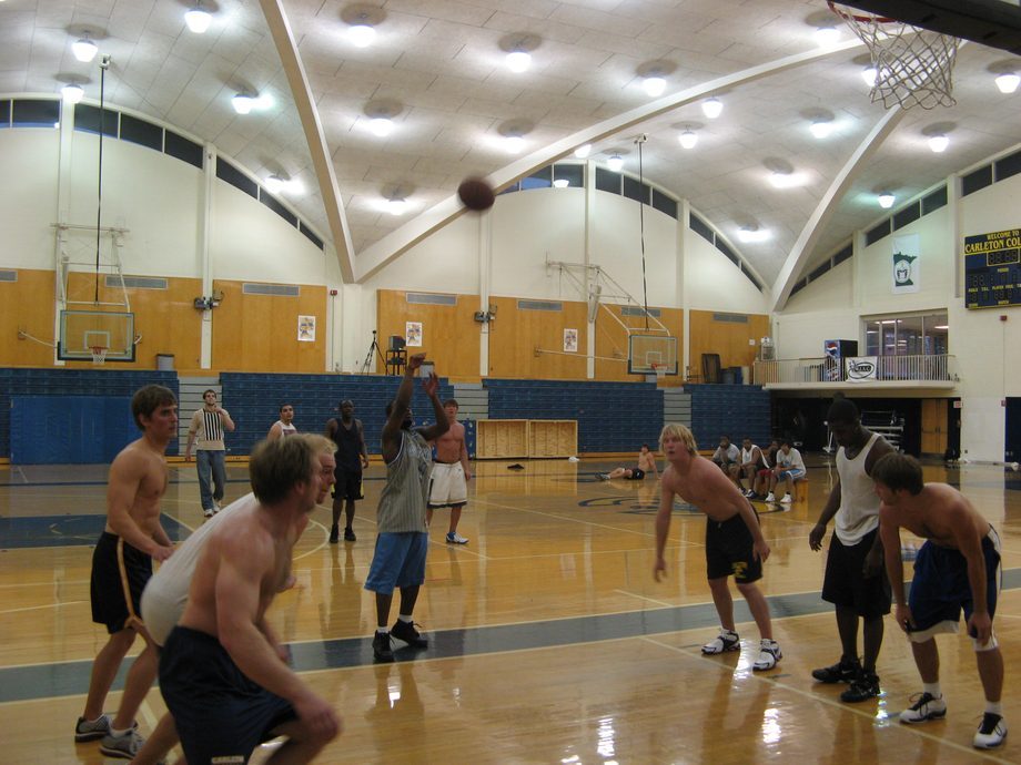 students playing basketball on a court