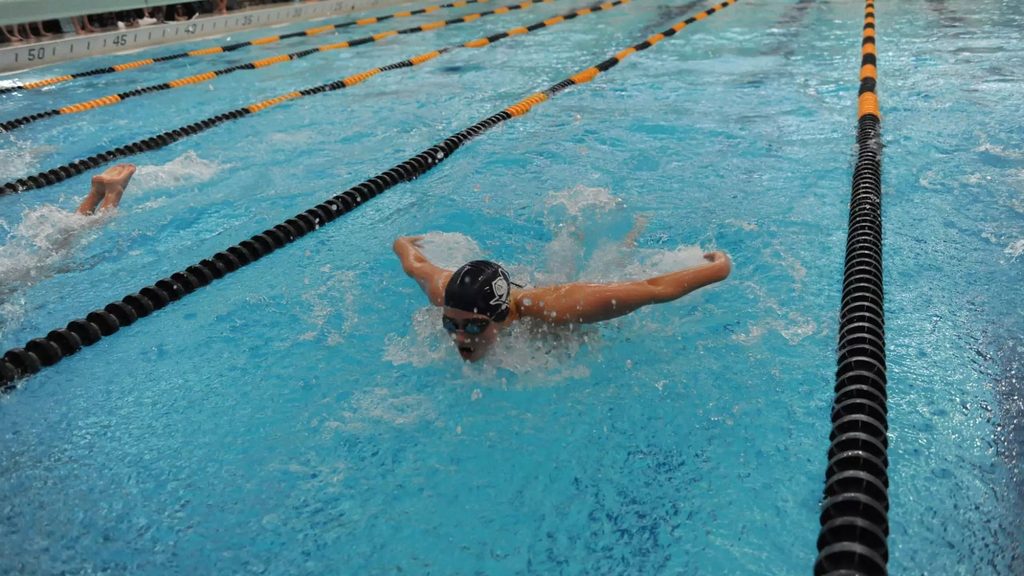 student swimming in a pool