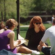 Deborah teaching outdoors with students in 1993