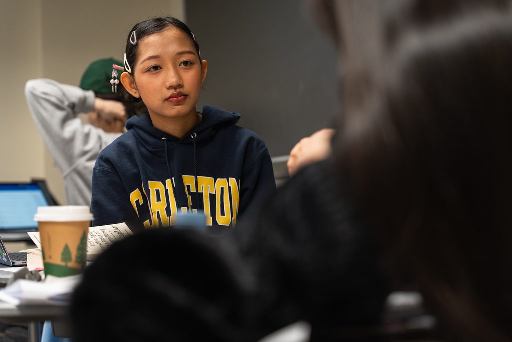 student seated in a classroom