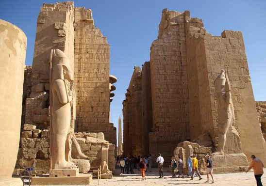 The great hypostyle hall at the Temple of Amun, Karnak. The obelisk of Hatshepsut in the distance.