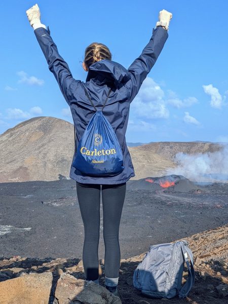 A person watches a volcano erupt