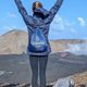 A person watches a volcano erupt