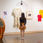 a student looks at artworks