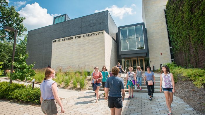 A group of people outside the Weitz Center for Creativity