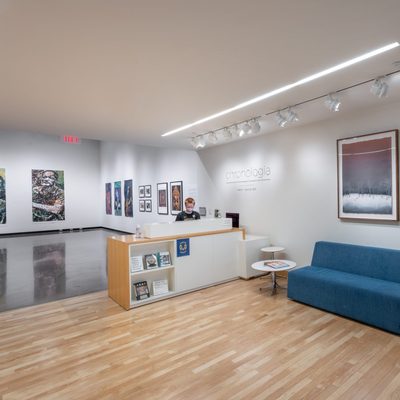 Interior of the Perlman Teaching Museum, showing the welcome desk and a few artworks