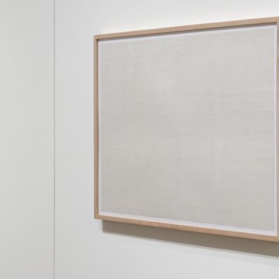 Two framed prints on white paper by Eleanor Jensen. The surface of the paper is covered in hundreds of small lines creating a blurry abstraction. The second print is cut off by the edge of the photo leaving only half in the image.