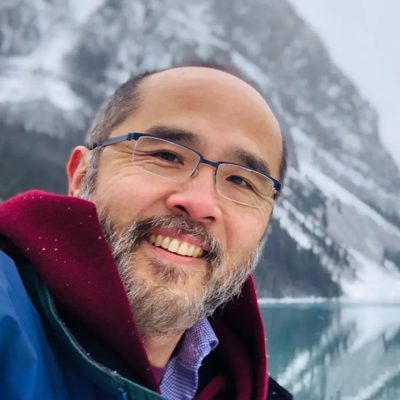 Francis Su outdoors at a snowy mountain lake