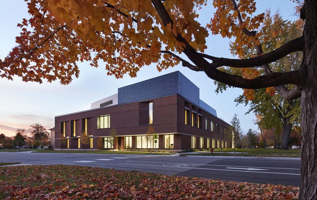 The exterior of the Music and Performance addition to the Weitz, with autumn leaves.