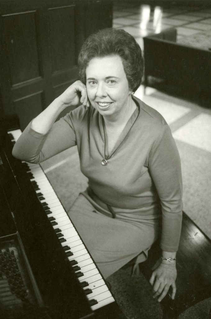 black and white photo of Anne Mayer at the keyboard