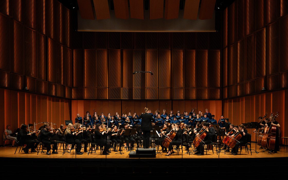 Orchestra and Choir perform onstage